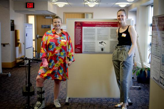 Two women standing in front of their research poster